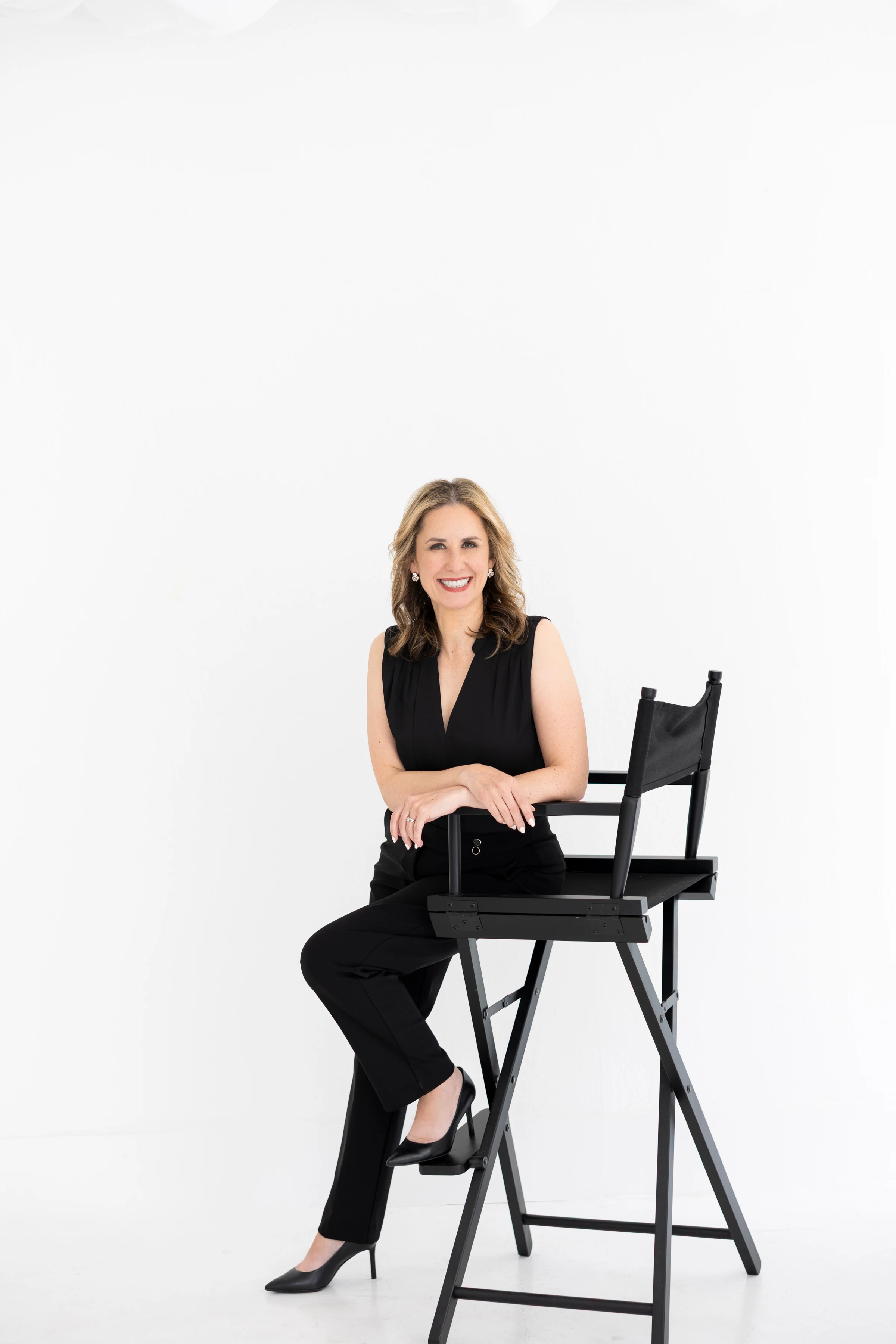 Laressa Watlington seated in a professional studio